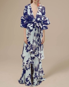 Detailed view of puff sleeves and floral print on a blue V-neck bohemian maxi dress