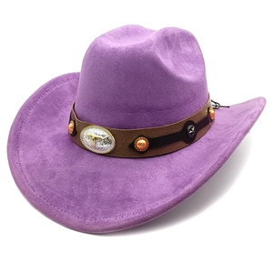 Detailed shot of purple suede cowboy hat featuring a silver bull head buckle and beads