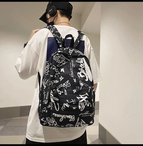 Detail shot of the street style graffiti pattern on the black and white backpack