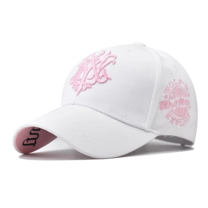Detail of pink 3D embroidery and side wolf explore logo on a white cotton baseball cap