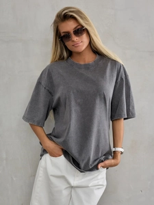 Detail of washed grey cotton T-shirt featuring drop shoulder seams and vintage texture