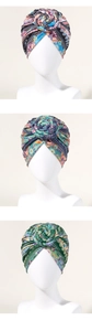 Detail of bohemian turbans with paisley prints and 3D rose flower knots for women