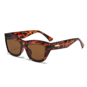 Retro cat-eye tortoiseshell sunglasses with brown lenses and gold metal temple accents