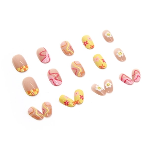 Press-on nails featuring yellow flowers, checkered patterns, and smiley face designs