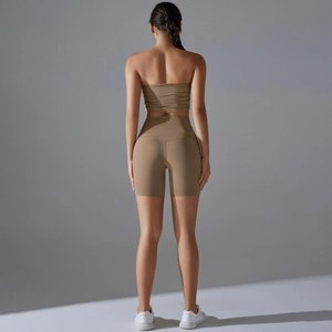 Detail view of khaki yoga set featuring slim-fit sports bra and high-waist cycling shorts