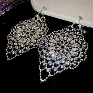 Detailed macro view of silver hollow mesh structure with shimmering diamond rhinestones