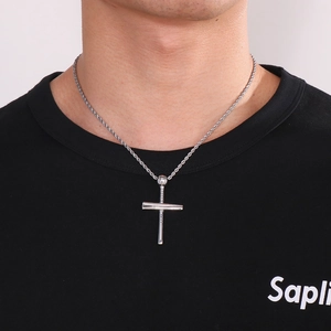 Men's silver baseball cross pendant necklace with twisted rope chain on a model