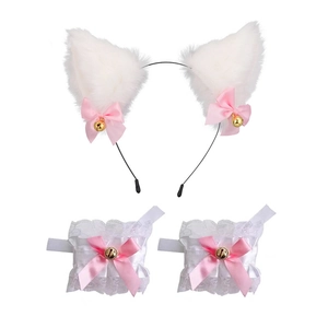 Detail of white faux fur cat ears headband and lace wristbands with pink bows and bells