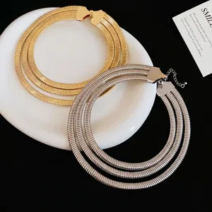 Three-layer metallic choker necklace in gold and silver finish with adjustable lobster clasp