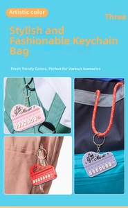 Detail of colorful mini piano keychains with Music lettering and portable metal ring