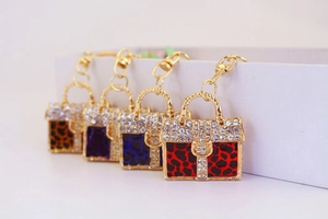 Sparkling leopard print handbag keychains in gold finish with vibrant colorful enamel