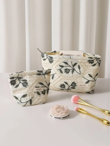 Linen floral embroidered makeup bag set with green leaf patterns and quilting detail