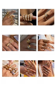 Vista detallada de anillos minimalistas de titanio dorado con circonitas y motivos corazón