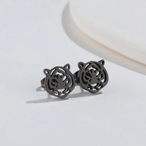 Macro shot of creative matte black hollow-out tiger head studs earrings for women