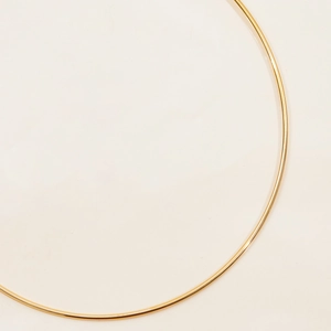 Detailed view of minimalist 18K gold plated stainless steel necklace with smooth finish