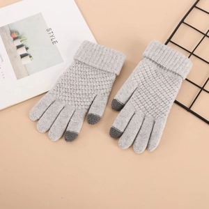 Detail of grey winter touchscreen gloves with honeycomb knit and windproof ribbed cuffs