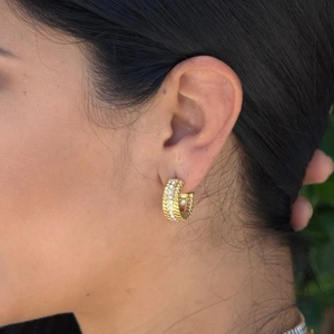 Chic gold hoop earrings with sparkling stones and textured rope edge on model