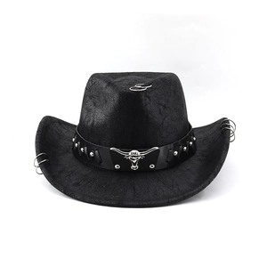 Detail of western cowboy hat with silver bull head ornament and metal rivets on leather band