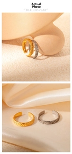 Detailed macro view of gold and silver vintage rings with intricate floral engraving