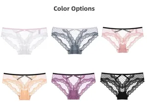 Detailed color display of sexy low-rise lace panties with polka dot mesh and cross straps