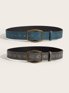 Detailed view of vintage embossed leather belts in teal and grey with bronze alloy buckles