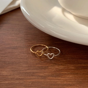 Minimalist 925 sterling silver open heart rings in gold and silver finish on wood
