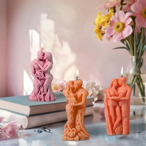 Three minimalist couple statues soy wax candles in dusty pink, brown and orange