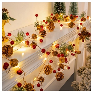 Warm LED Christmas string lights with pine cones and red berries on a white fireplace