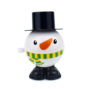Detail of wind-up snowman toy with black hat and green scarf for Christmas gift sets