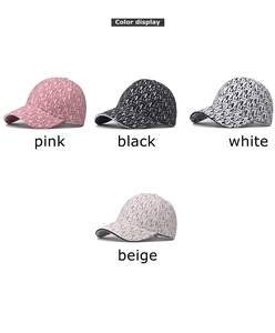 Detailed color display of houndstooth baseball caps in pink, black, white, and beige