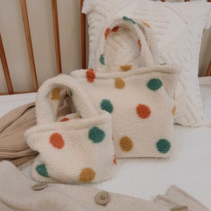 Vintage polka dot sherpa tote bag for women featuring cozy soft plush fabric and warm colors
