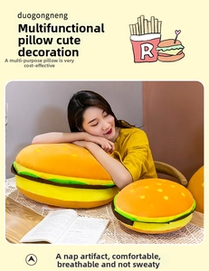 Detail of plush hamburger pillow featuring colorful tiered bread, lettuce and meat layers