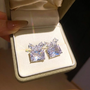 Elegant silver zircon butterfly square stud earrings displayed in a luxury velvet gift box