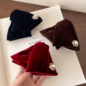 Elegant velvet flower hair clips in black, brown, and wine red with pearl accents