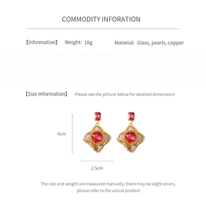 Detail view of vintage red glass earrings with pearls and dimensions 4cm x 2.5cm