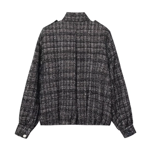 Women's black and white tweed jacket back view with silver cuff button details