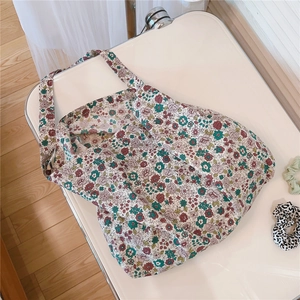 Detailed close-up of vintage floral print fabric on a cotton canvas tote bag