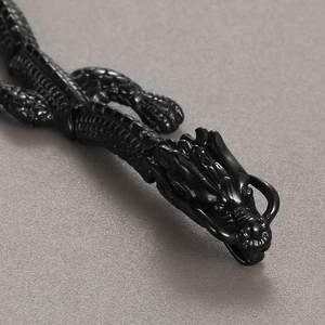 Macro shot of 18k black plated stainless steel dragon bracelet with detailed scales