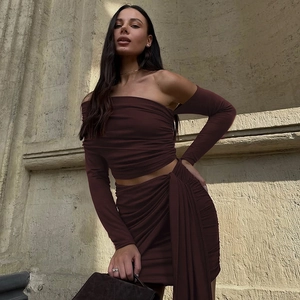 Detail of coffee off-shoulder long sleeve top and ruched mini skirt with side drape