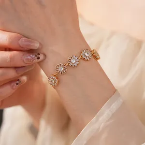 Close-up of gold-plated daisy bracelet with sparkling marquise zirconia petals