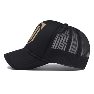 Side view of black trucker hat with mesh back and golden geometric logo detail