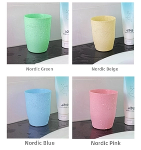 Detailed grid view of four plastic mouthwash cups in green beige blue and pink colors