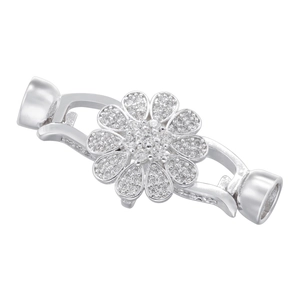 Macro detail of silver flower clasp connector with sparkling rhinestones for jewelry making