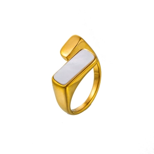 Macro shot of geometric gold titanium steel ring featuring a white mother-of-pearl inlay