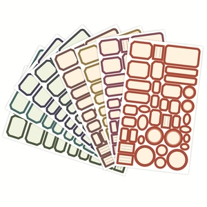 Close-up of vintage labels in geometric shapes and earthy tones for DIY scrapbooking
