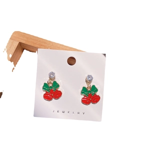 Festive red and green Christmas bell drop earrings with sparkling white crystals on jewelry card
