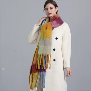Detail of soft rainbow plaid scarf with long tassels and chunky mohair texture