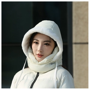 Detail of white padded winter hood with integrated neck warmer and faux fur trim