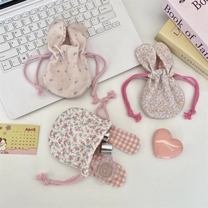 Set of floral bunny ear drawstring storage pouches in three cute patterns for cosmetics