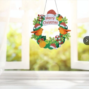 Detailed view of DIY 5D diamond painting Christmas wreath with birds and candy canes